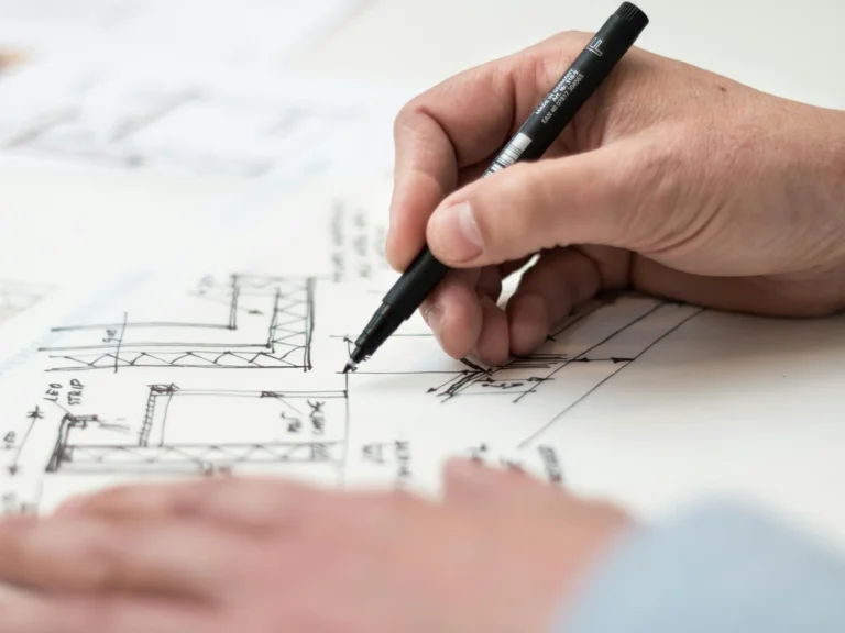 Livark construction services image of man hand drawing a construction sketch
